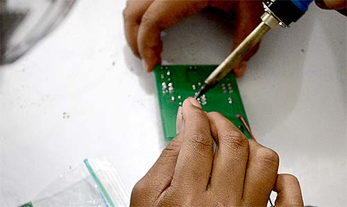 students learn to solder